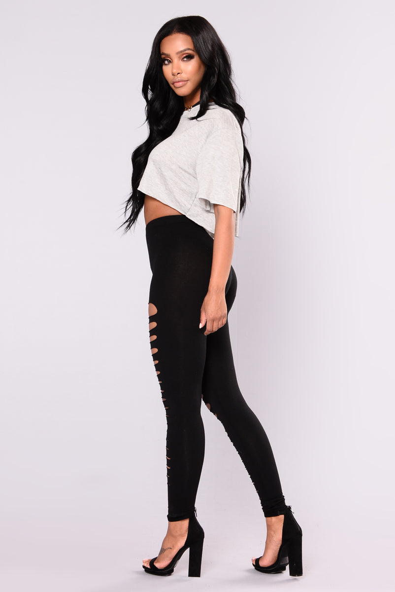 Edgy Girl With Ripped Black Leggings And High Boots Stock Photo, Picture  and Royalty Free Image. Image 58504295.