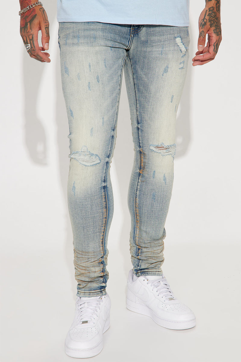 Drop It Ripped Knee Stacked Skinny Jeans - Medium Wash | Fashion Nova ...
