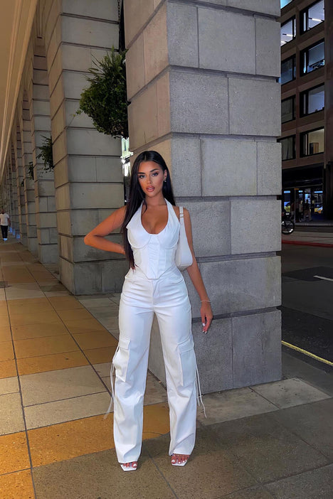 Karina wears agolde white leather pants with white top and feather  bagKarina wears agolde white leather pants with white top and feather bag -  Karina Style Diaries