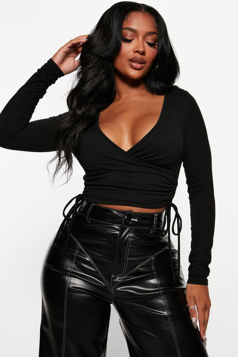 Femme Luxe long sleeve cut out waist crop top with belt detail in black